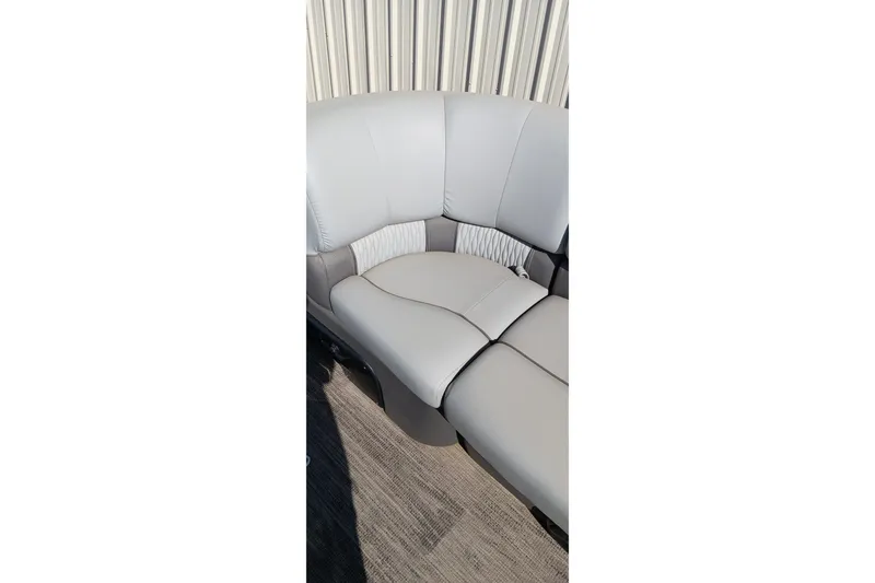 Slide: The Image of 2023 Ranger 2500LS boat interior with gray cushioned seating. - 37
