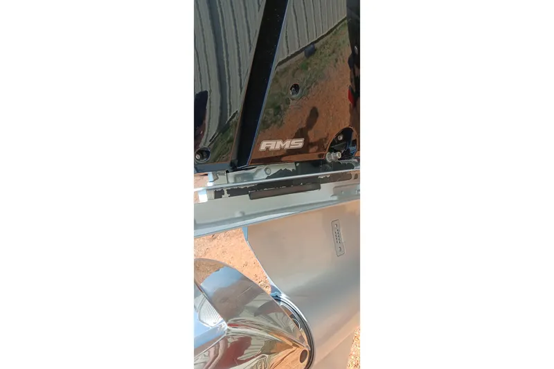 Slide: The Image of 2023 Ranger 2500LS boat detail with AMS logo and metallic components. - 44