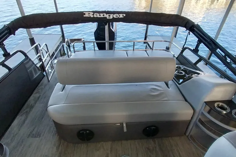 Slide: The Image of Interior of 2023 Ranger 2500LS boat with gray seating and cup holders. - 55