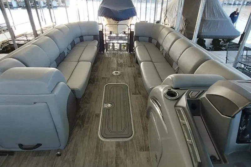 Slide: The Image of Luxurious interior of 2023 Ranger 2500LS pontoon boat with plush seating and modern design. - 57