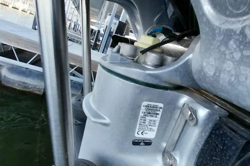 Slide: The Image of Close-up of a 2023 Ranger 2500LS boat motor component at a dock. - 62