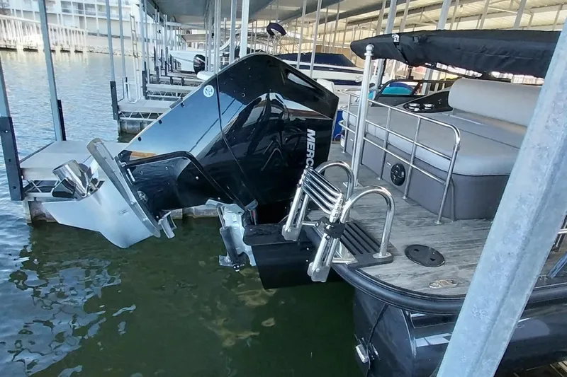 Slide: The Image of 2023 Ranger 2500LS boat docked with Mercury outboard motor in marina. - 63
