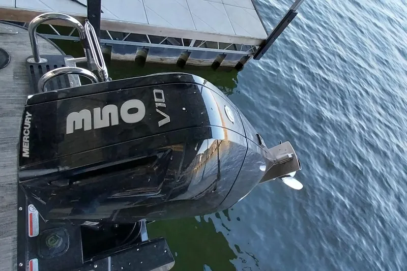 Slide: The Image of 2023 Ranger 2500LS boat with Mercury V10 outboard engine at dockside. - 65