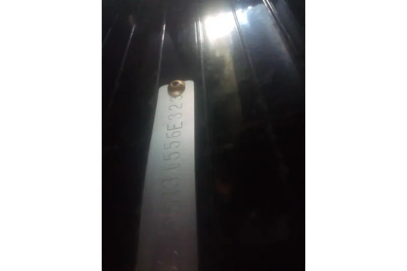 Slide: The Image of Metallic serial number plate on a 2023 Ranger 2500LS boat. - 66