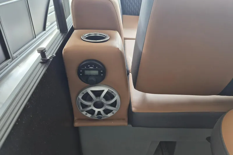 Slide: The Image of Interior of 2026 Sylvan L3 DLZ Bar with speaker and cup holder detail. - 14