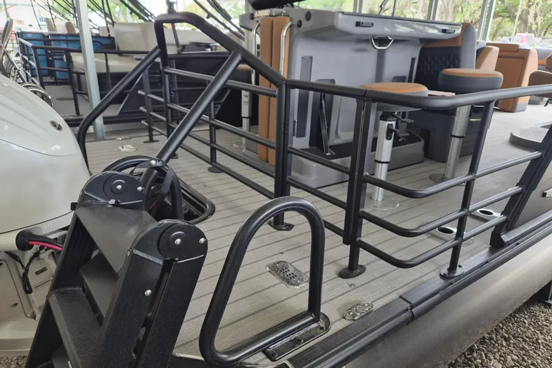 Slide: The Image of 2026 Sylvan L3 DLZ Bar pontoon boat with sleek railing and modern seating. - 17