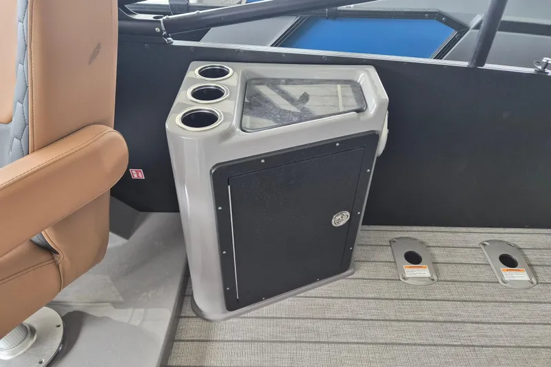 Slide: The Image of Interior of 2026 Sylvan L3 DLZ Bar with cup holders and storage compartment. - 9