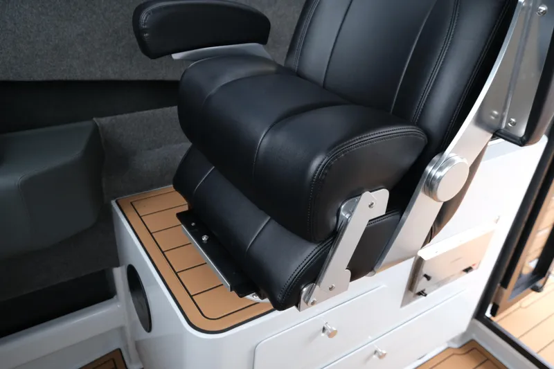 Slide: The Image of Luxurious black leather seat in 2026 Makaira 28 boat interior. - 16