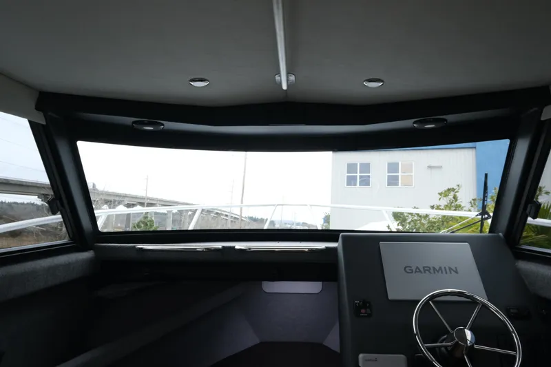 Slide: The Image of Interior view of 2026 Makaira 28 boat cockpit with Garmin navigation system. - 17