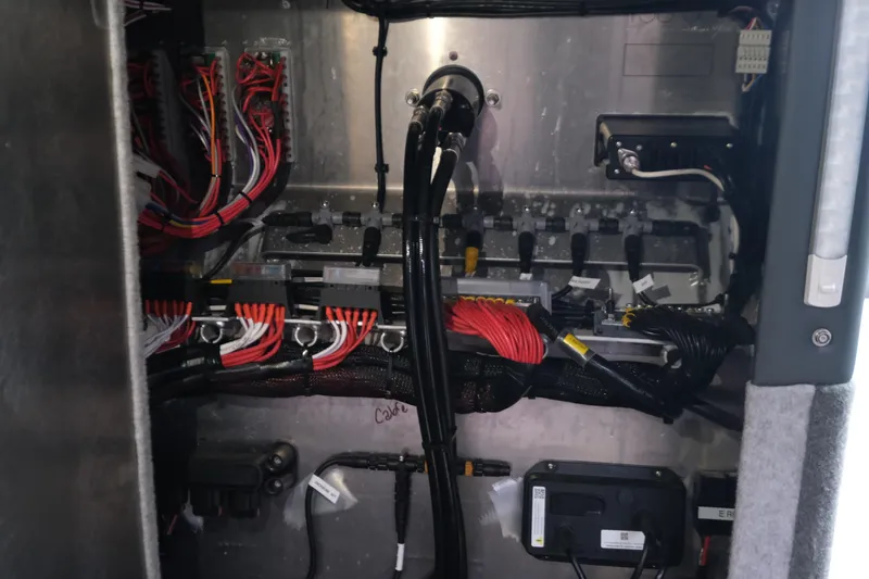 Slide: The Image of Electrical wiring and components inside a Makaira 28, 2026 model. - 21