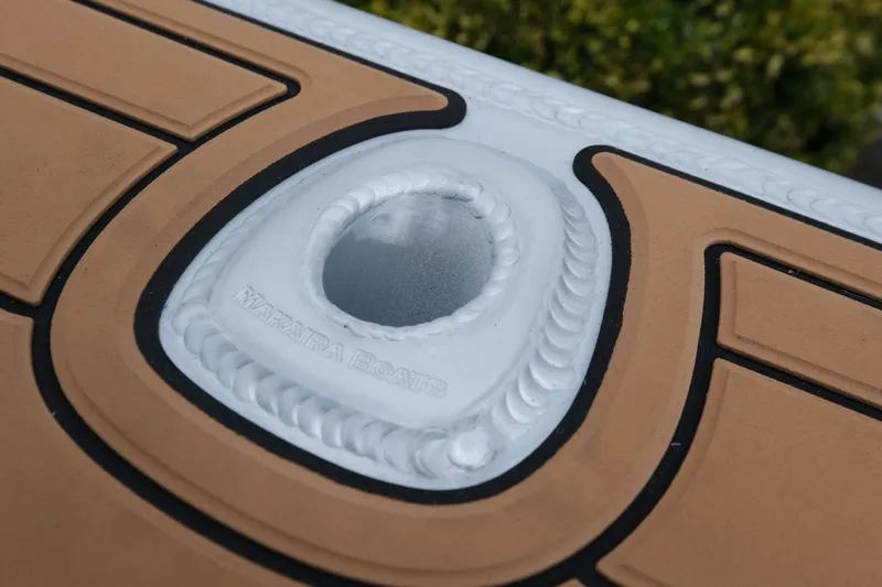 Slide: The Image of Makaira 28 boat deck detail, featuring textured surface and branded logo, 2026 model. - 22