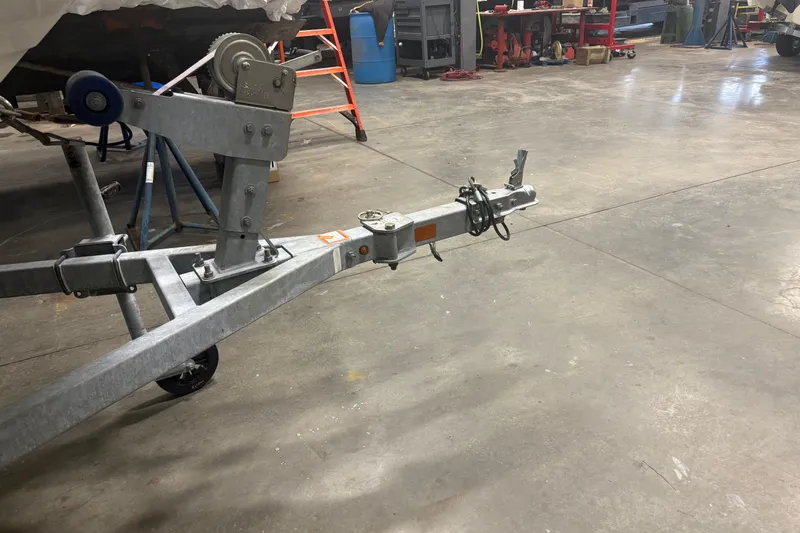 Slide: The Image of Trailer hitch for 2016 Boston Whaler 150 Super Sport in a workshop setting. - 12