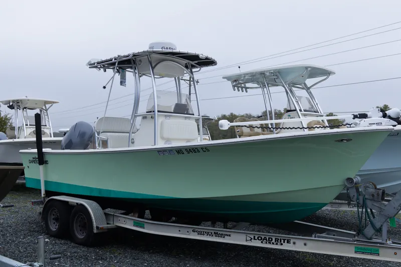 The Image of 2018 May-Craft 23 Cape Classic boat on trailer, parked outdoors. - 1