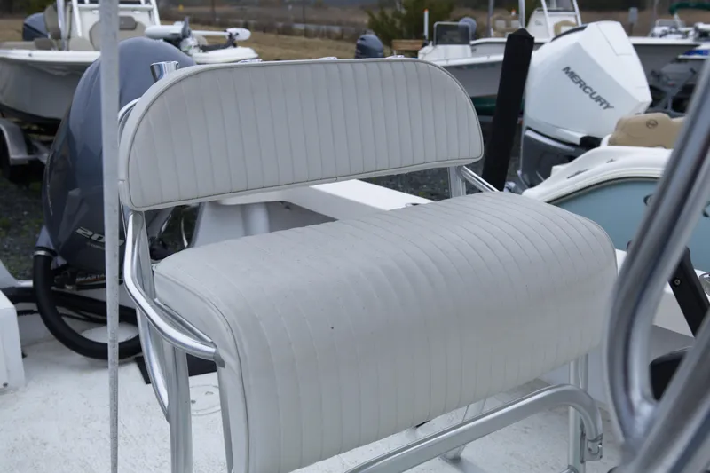 Slide: The Image of 2018 May-Craft 23 Cape Classic boat seat with white upholstery and metal frame. - 10