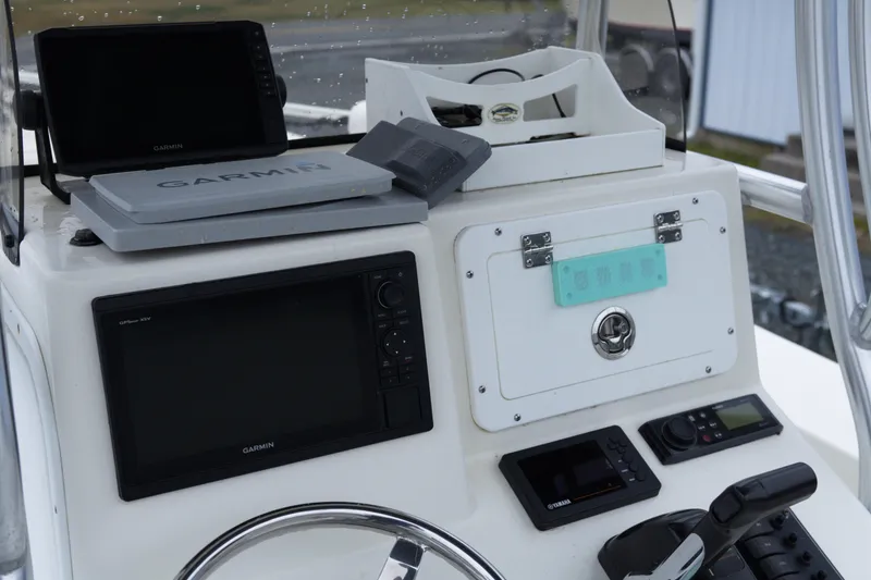 Slide: The Image of Control panel of a 2018 May-Craft 23 Cape Classic boat with Garmin electronics. - 12