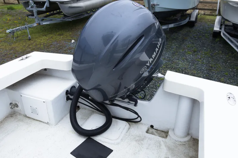 Slide: The Image of 2018 May-Craft 23 Cape Classic boat with Yamaha outboard motor, parked on trailer. - 17