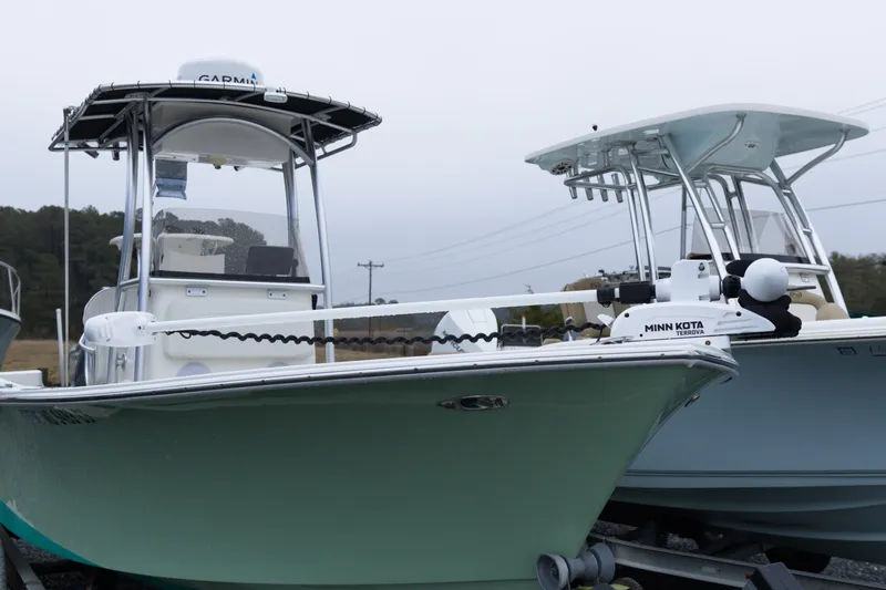 Slide: The Image of 2018 May-Craft 23 Cape Classic boat with Minn Kota motor, docked outdoors. - 6