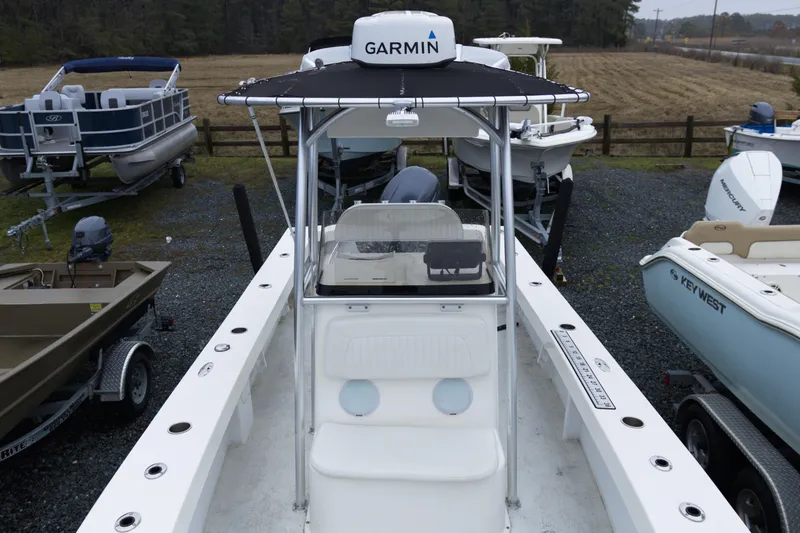 Slide: The Image of 2018 May-Craft 23 Cape Classic boat with Garmin equipment, docked among other boats. - 8
