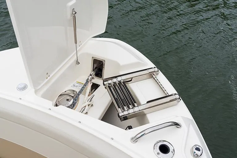 Slide: The Image of Manufacturer Provided Image: 2023 Boston Whaler 240 Vantage bow storage compartment with ladder and anchor. - 16