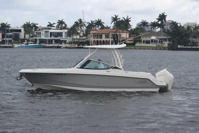 Slide: The Image of 2023 Boston Whaler 240 Vantage boat interior with city skyline view. - 20