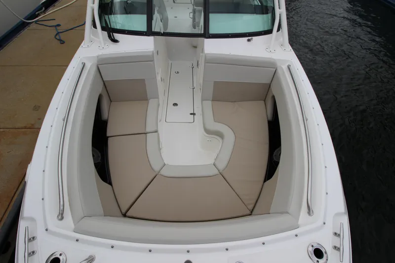 Slide: The Image of 2023 Boston Whaler 240 Vantage boat storage compartment, open and empty. - 22