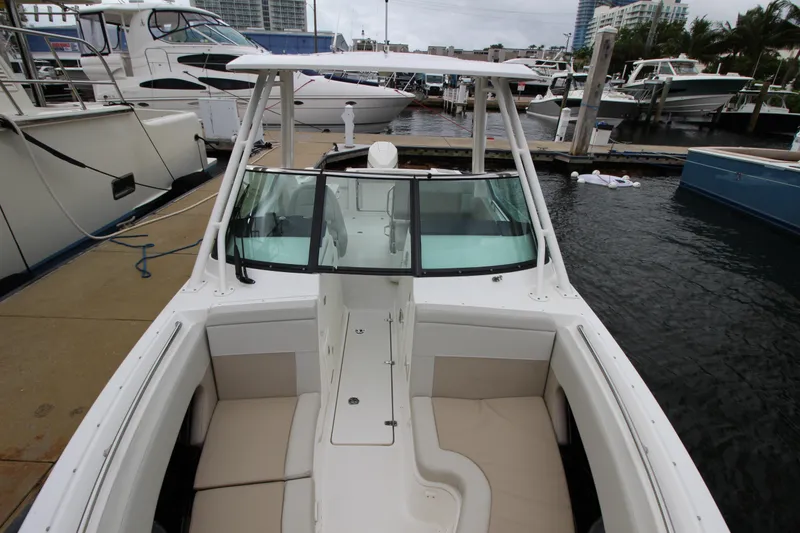 Slide: The Image of 2023 Boston Whaler 240 Vantage boat interior with steering wheel and seat. - 23