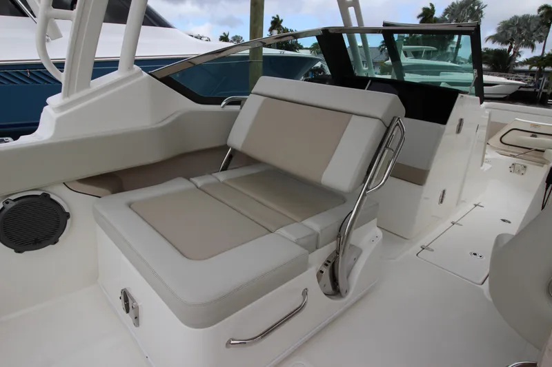 Slide: The Image of Interior view of 2023 Boston Whaler 240 Vantage boat, featuring seating and storage. - 33