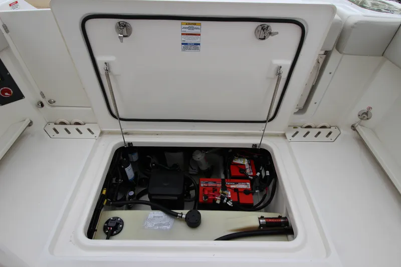 Slide: The Image of 2023 Boston Whaler 240 Vantage helm with steering wheel and navigation display. - 38