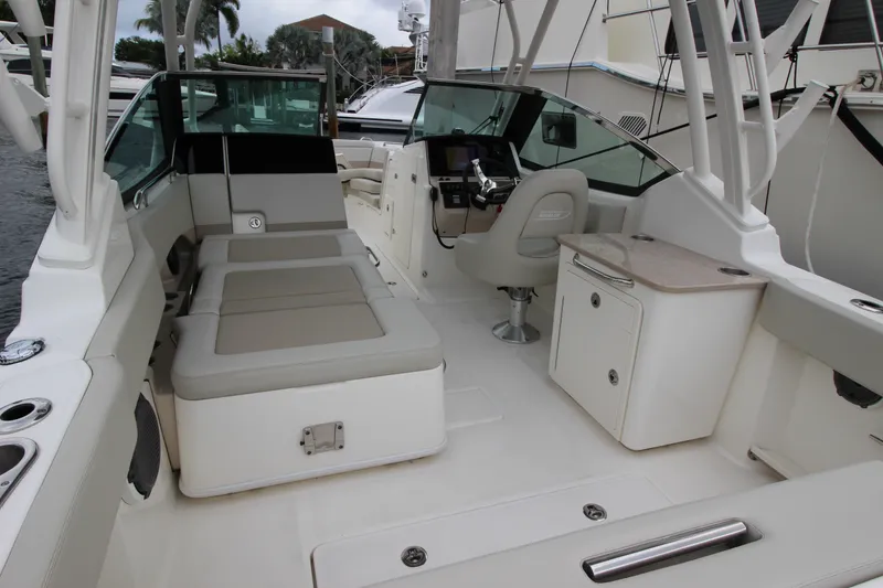 Slide: The Image of 2023 Boston Whaler 240 Vantage boat interior with cushioned seating and sleek design. - 39