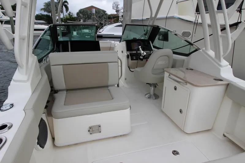 Slide: The Image of 2023 Boston Whaler 240 Vantage interior with cushioned seating and sleek design. - 40