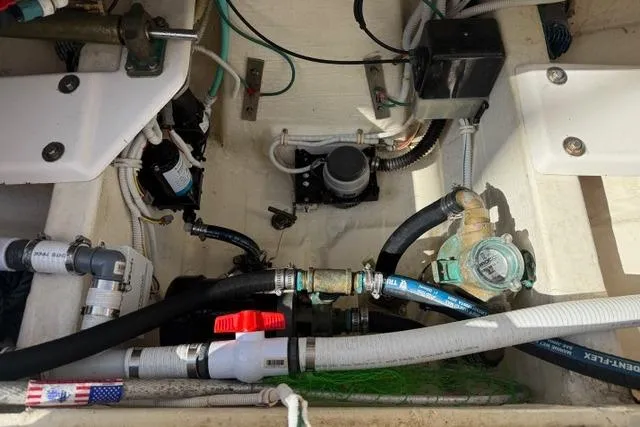 Slide: The Image of Engine compartment of a 2010 Tiara Yachts 3900 Open, showcasing various mechanical components. - 19
