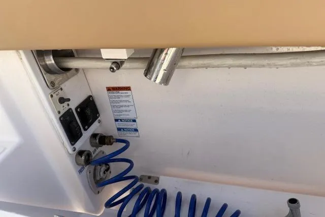 Slide: The Image of Control panel and hose on a 2010 Tiara Yachts 3900 Open boat. - 23