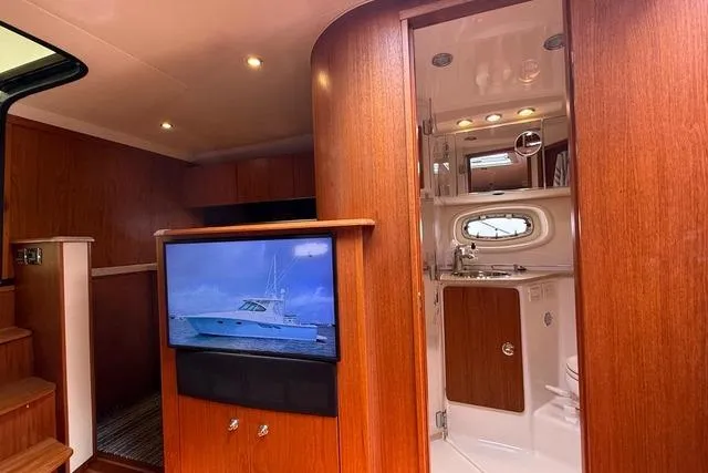 Slide: The Image of Luxurious interior of 2010 Tiara Yachts 3900 Open with wood finish and modern amenities. - 31