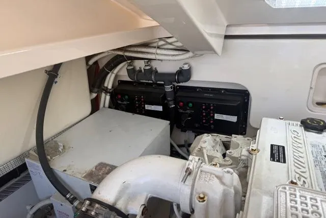 Slide: The Image of Engine compartment of a 2010 Tiara Yachts 3900 Open, showcasing mechanical components and wiring. - 43