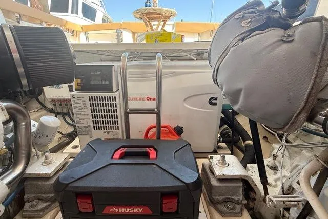 Slide: The Image of Engine room of 2010 Tiara Yachts 3900 Open with Cummins Onan generator and Husky toolbox. - 44