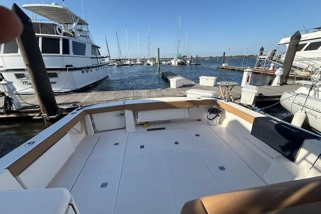 Slide: The Image of Tiara Yachts 3900 Open 2010 model docked at marina, spacious deck view. - 5