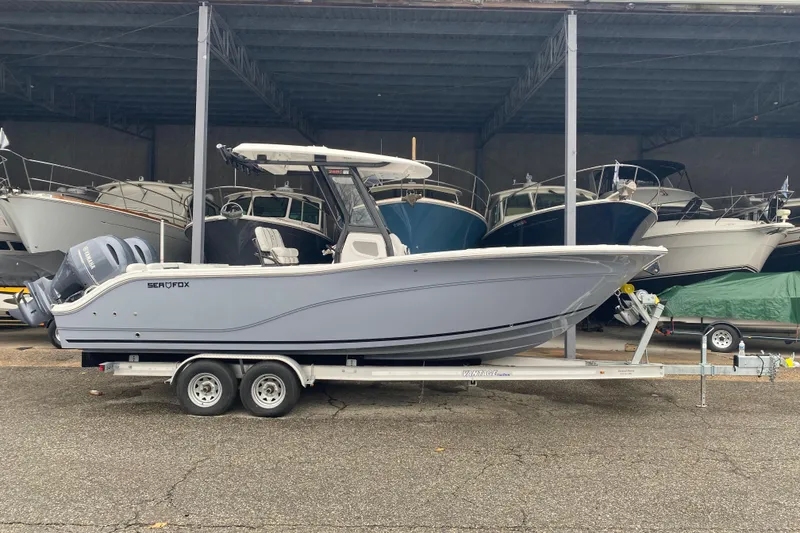 The Image of 2026 Sea Fox 268 Commander boat on trailer in storage facility. - 0