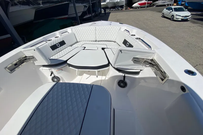 Slide: The Image of 2026 Sea Fox 268 Commander boat interior with cushioned seating and storage compartments. - 15