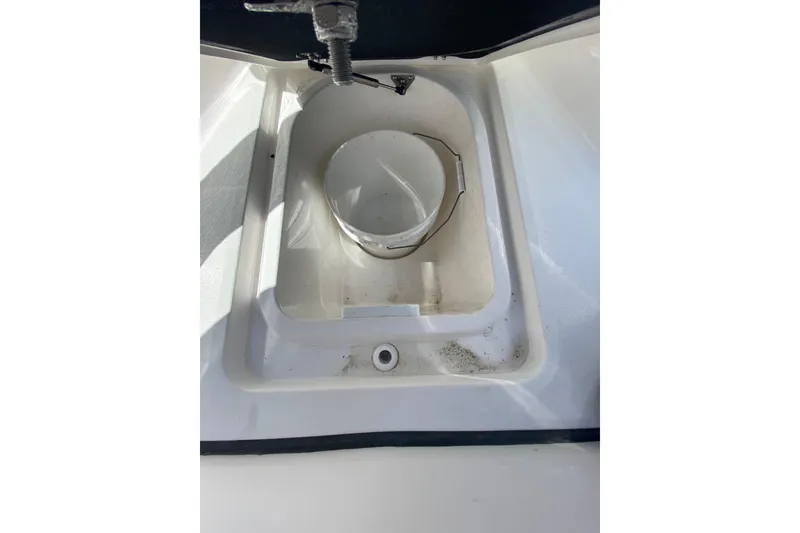 Slide: The Image of Storage compartment of 2026 Sea Fox 268 Commander boat, featuring a built-in bucket holder. - 18
