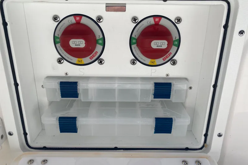 Slide: The Image of Battery switches and storage compartments on a 2026 Sea Fox 268 Commander boat. - 21