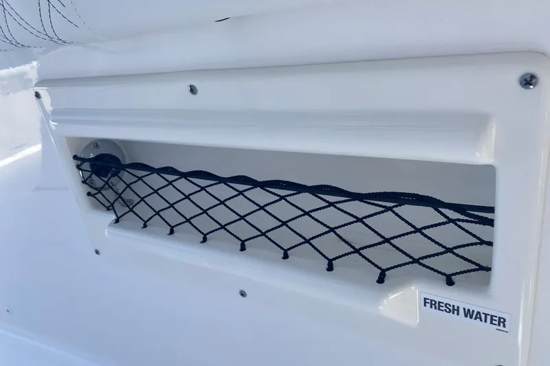 Slide: The Image of Freshwater compartment with netting on 2026 Sea Fox 268 Commander boat. - 23
