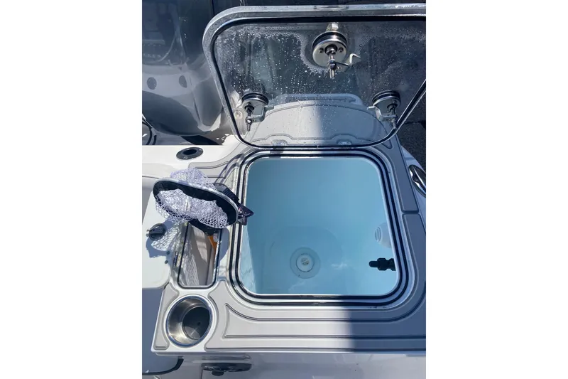 Slide: The Image of Livewell on 2026 Sea Fox 268 Commander boat, featuring a clear lid and integrated faucet. - 4