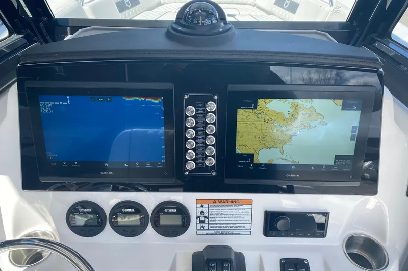 Slide: The Image of Dashboard of 2026 Sea Fox 268 Commander with Garmin navigation displays. - 8