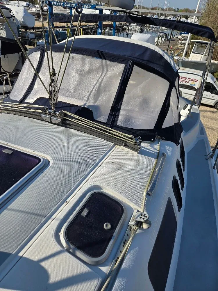 Slide: The Image of 1995 Hunter 336 sailboat with canopy in harbor. - 29