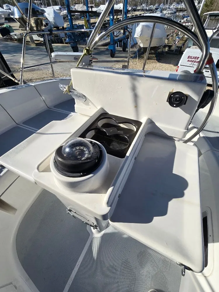 Slide: The Image of Cockpit of a 1995 Hunter 336 yacht featuring a compass. - 34