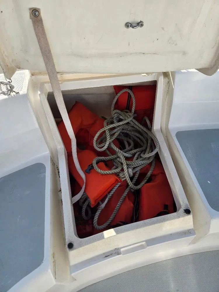 Slide: The Image of Storage compartment of Hunter 336 with life jackets and ropes. - 35