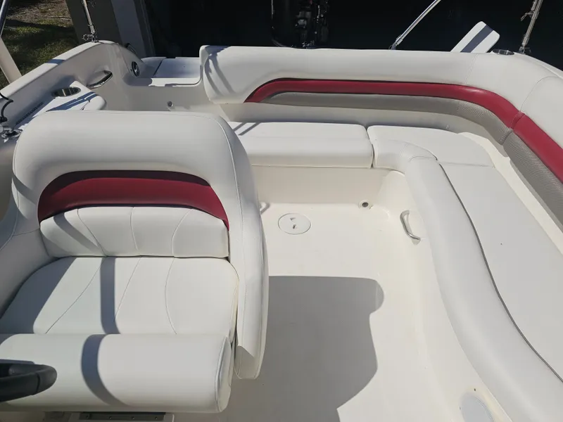 Slide: The Image of Interior of a 2012 Godfrey Hurricane 217 Sundeck boat with white and red seating. - 10