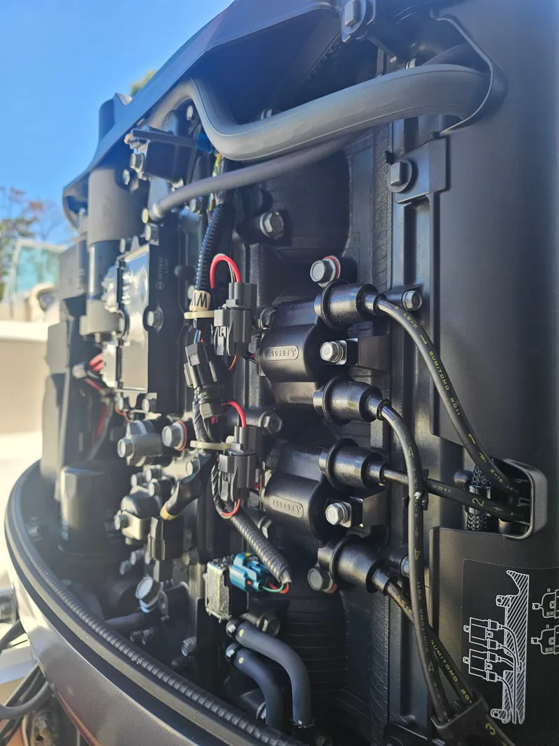 Slide: The Image of Close-up of a 2012 Godfrey Hurricane 217 Sundeck boat engine. - 16