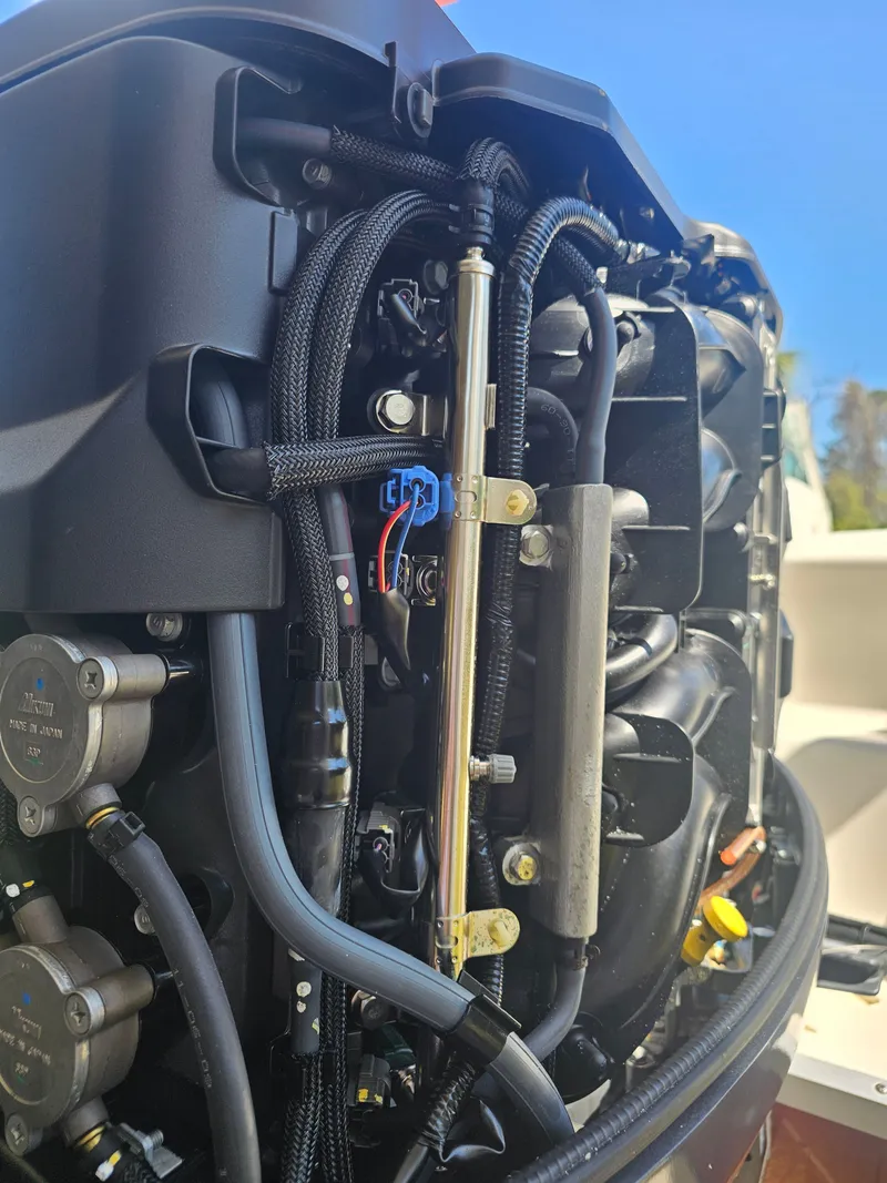 Slide: The Image of Close-up of a 2012 Godfrey Hurricane 217 Sundeck engine. - 17