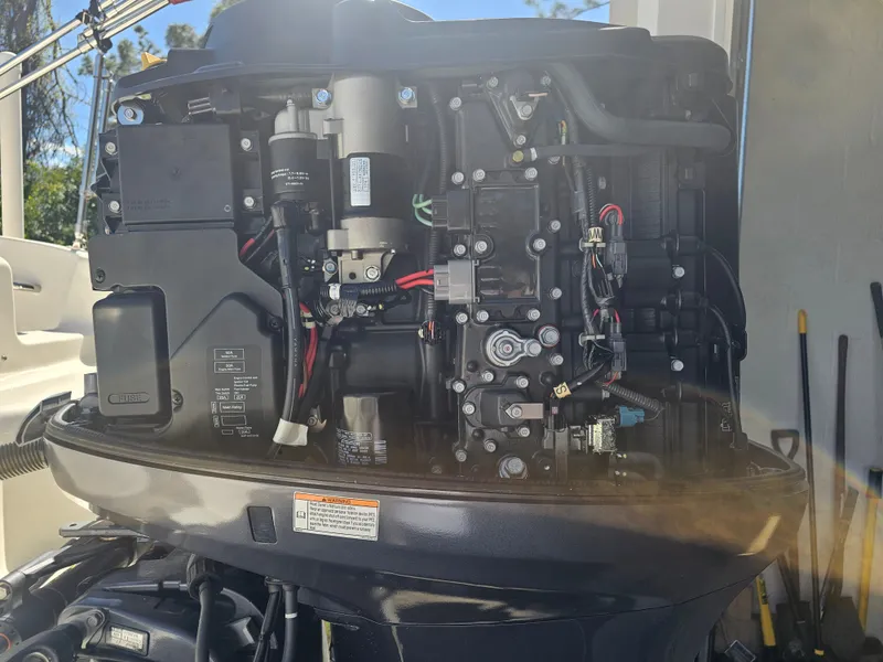 Slide: The Image of Engine of a 2012 Godfrey Hurricane 217 Sundeck boat. - 18